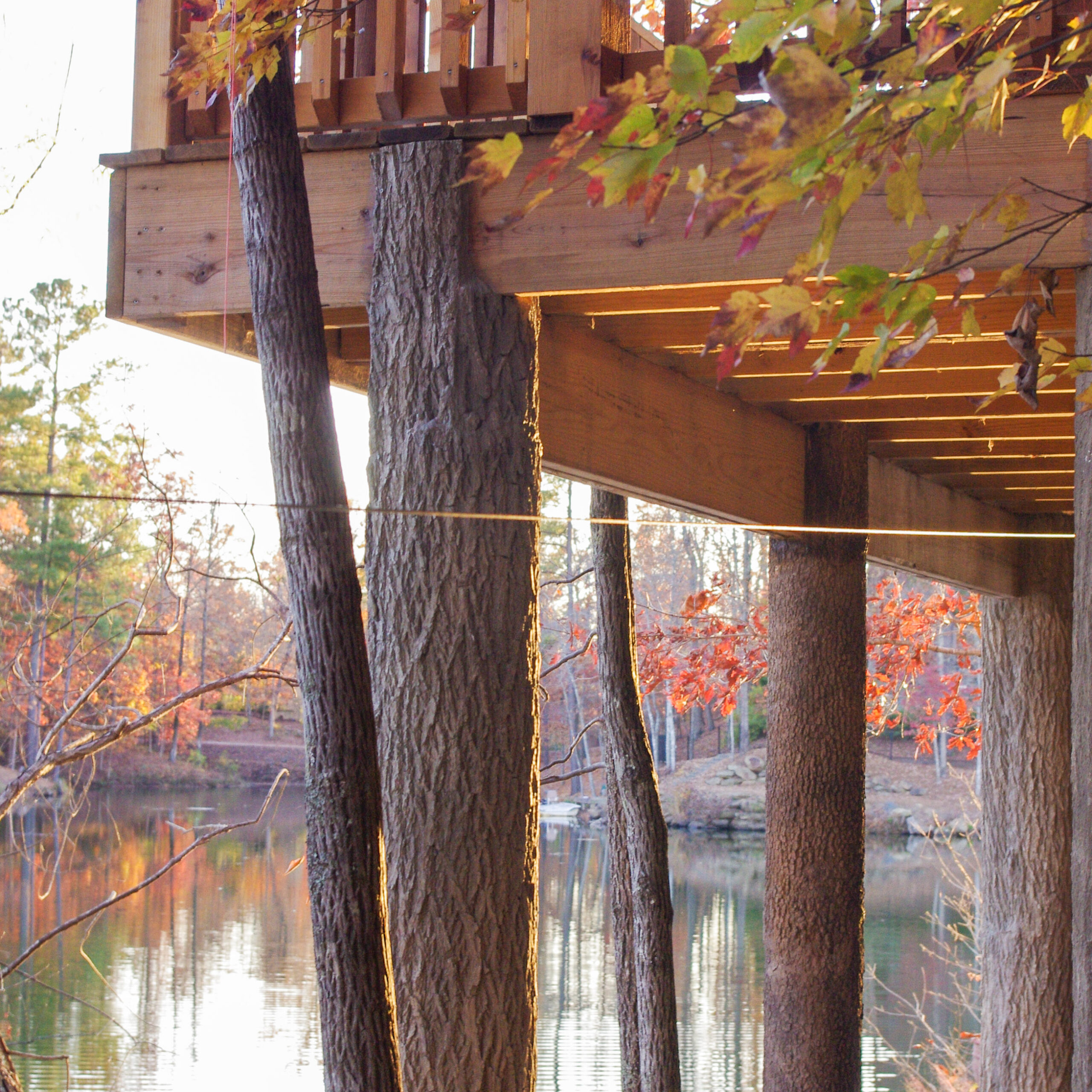 Flexbark covered deck posts at lake house